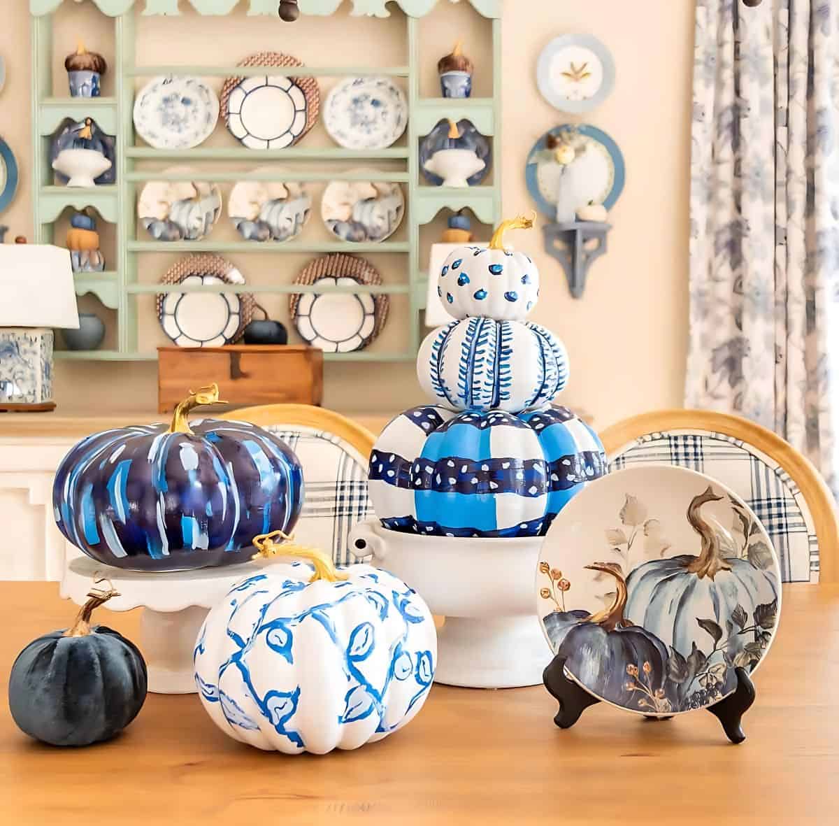 blue and white DIY painted pumpkins used as a centerpiece