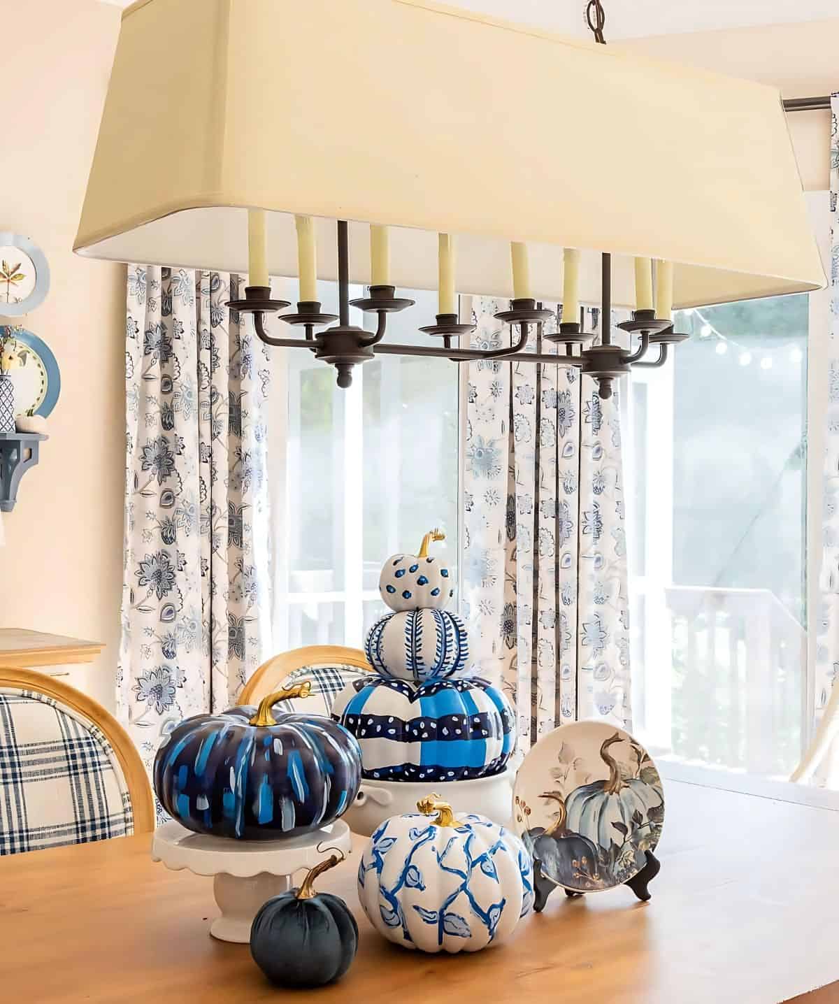 blue and white DIY painted pumpkins used as a centerpiece