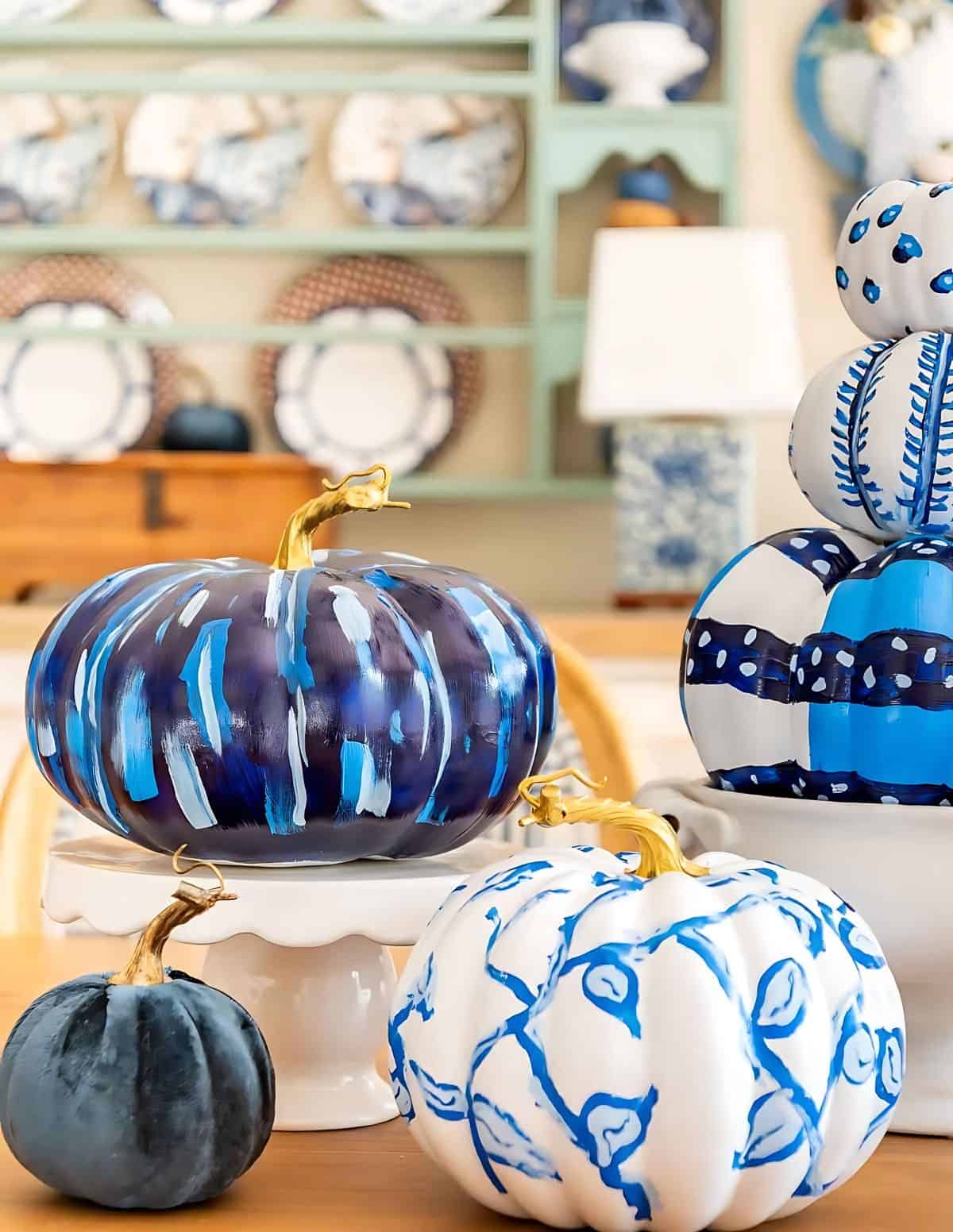 blue and white DIY painted pumpkins used as a centerpiece