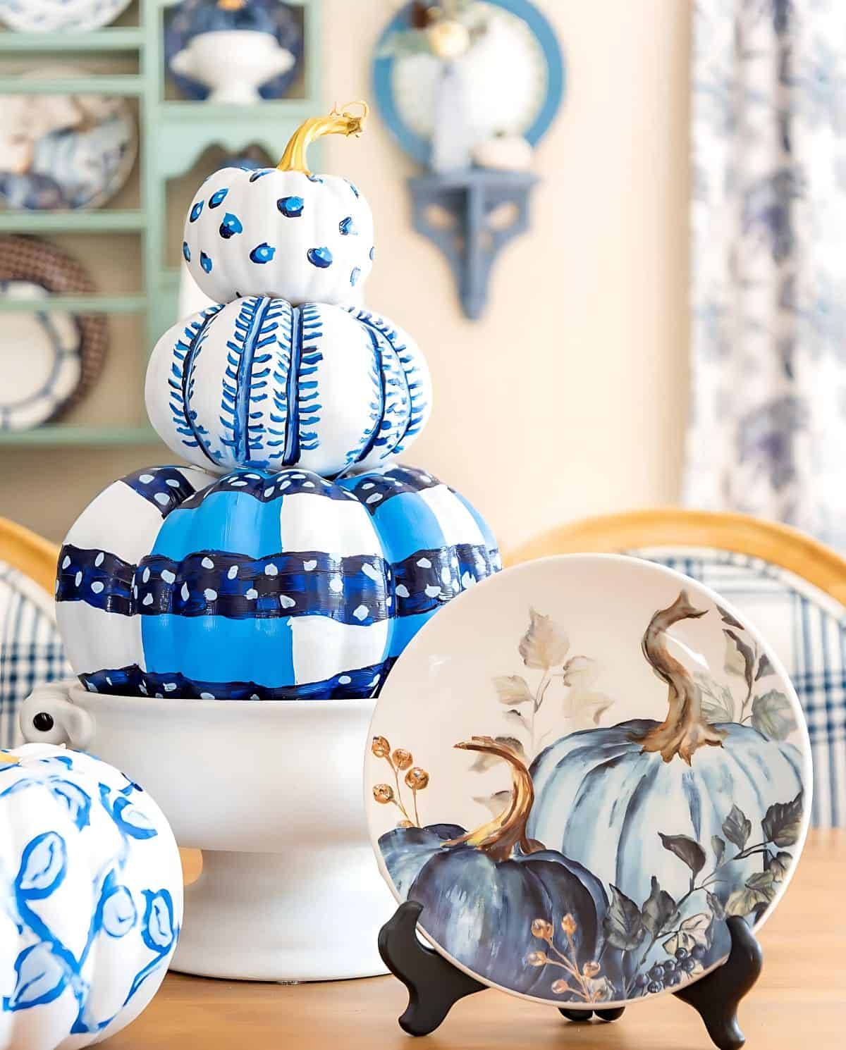 blue and white DIY painted pumpkins used as a centerpiece