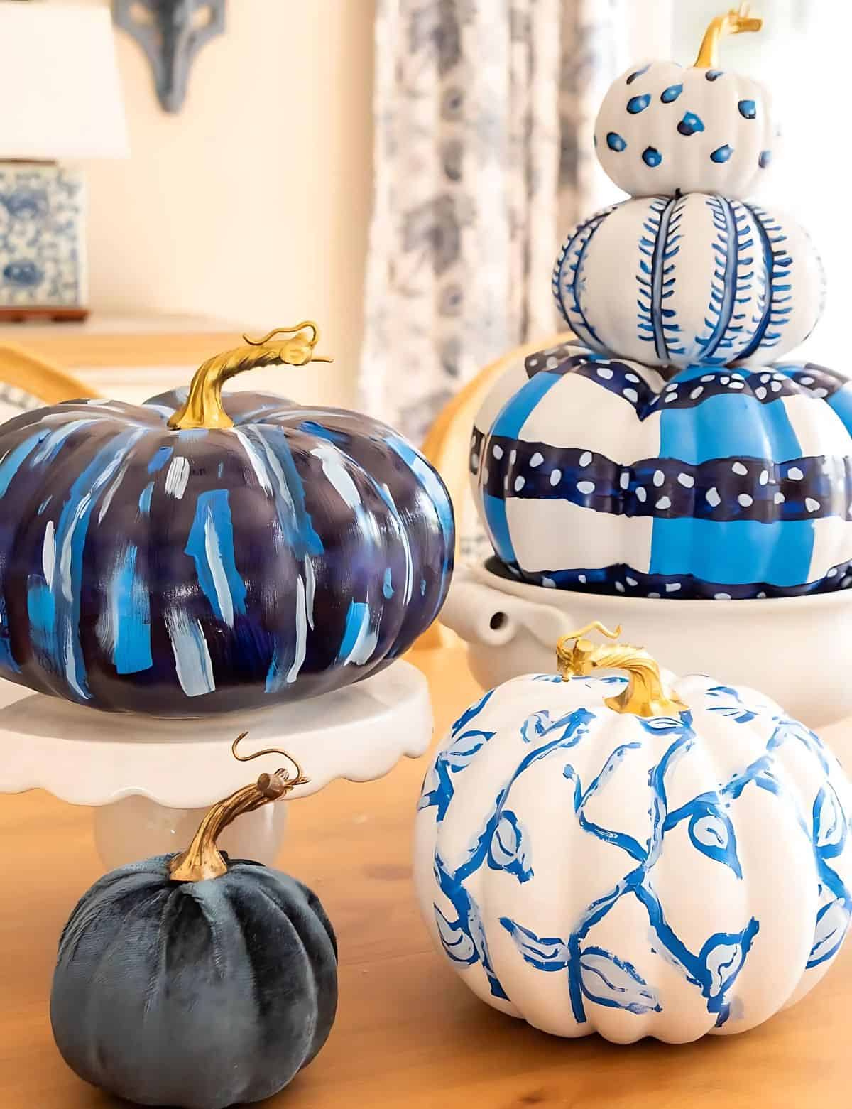 blue and white DIY painted pumpkins used as a centerpiece