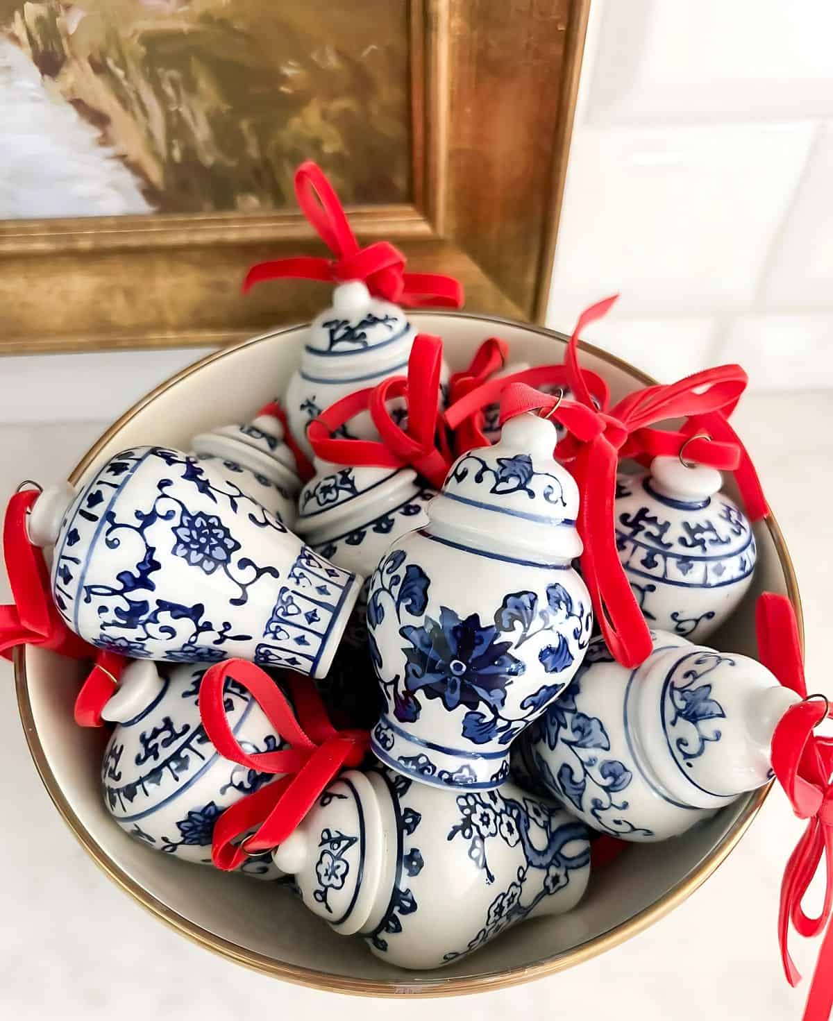 overhead view of bowl filled with mini blue and white ginger jar Christmas ornaments