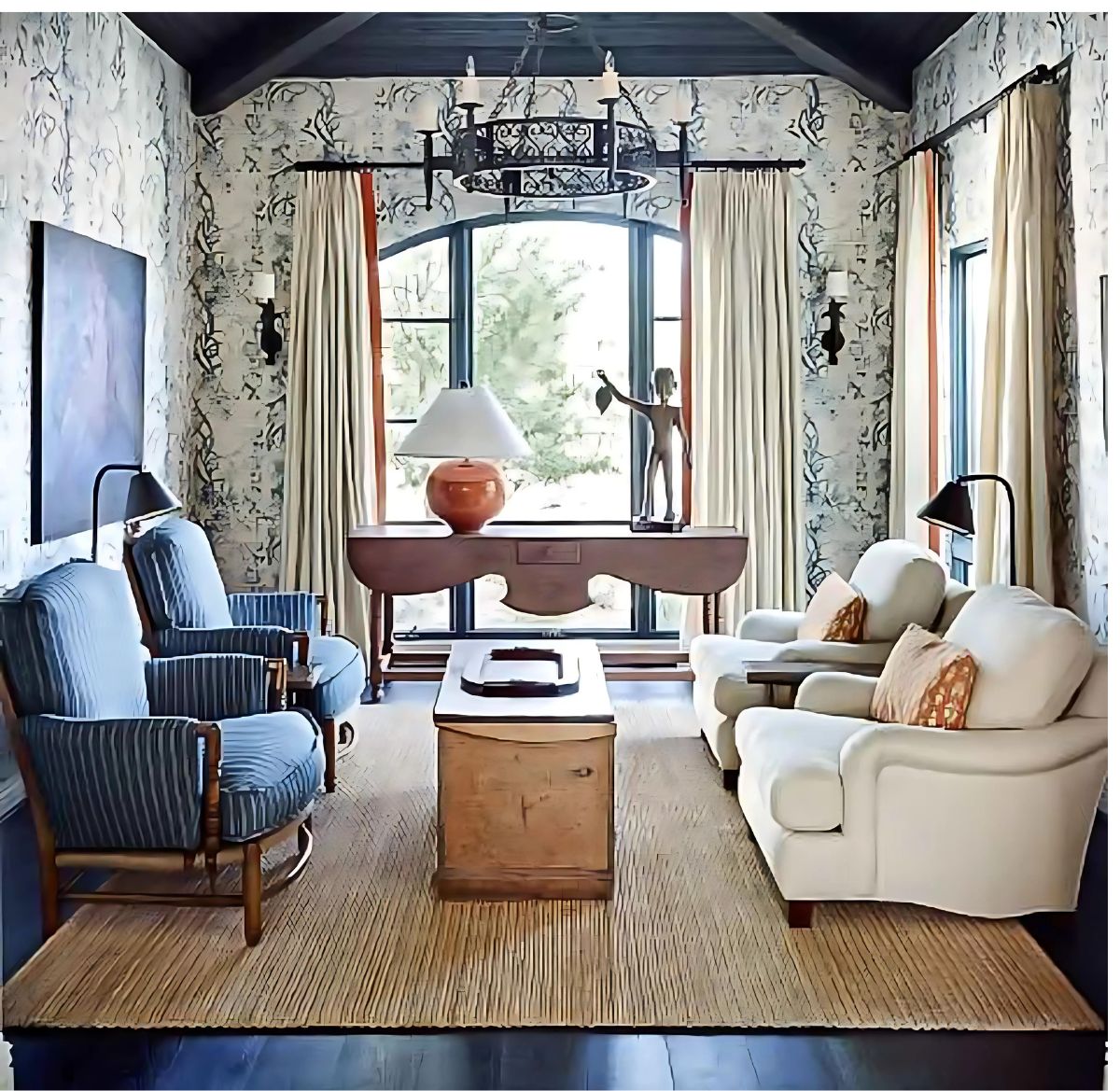 cozy living room with blue chairs and white chairs and blue and white wallpaper