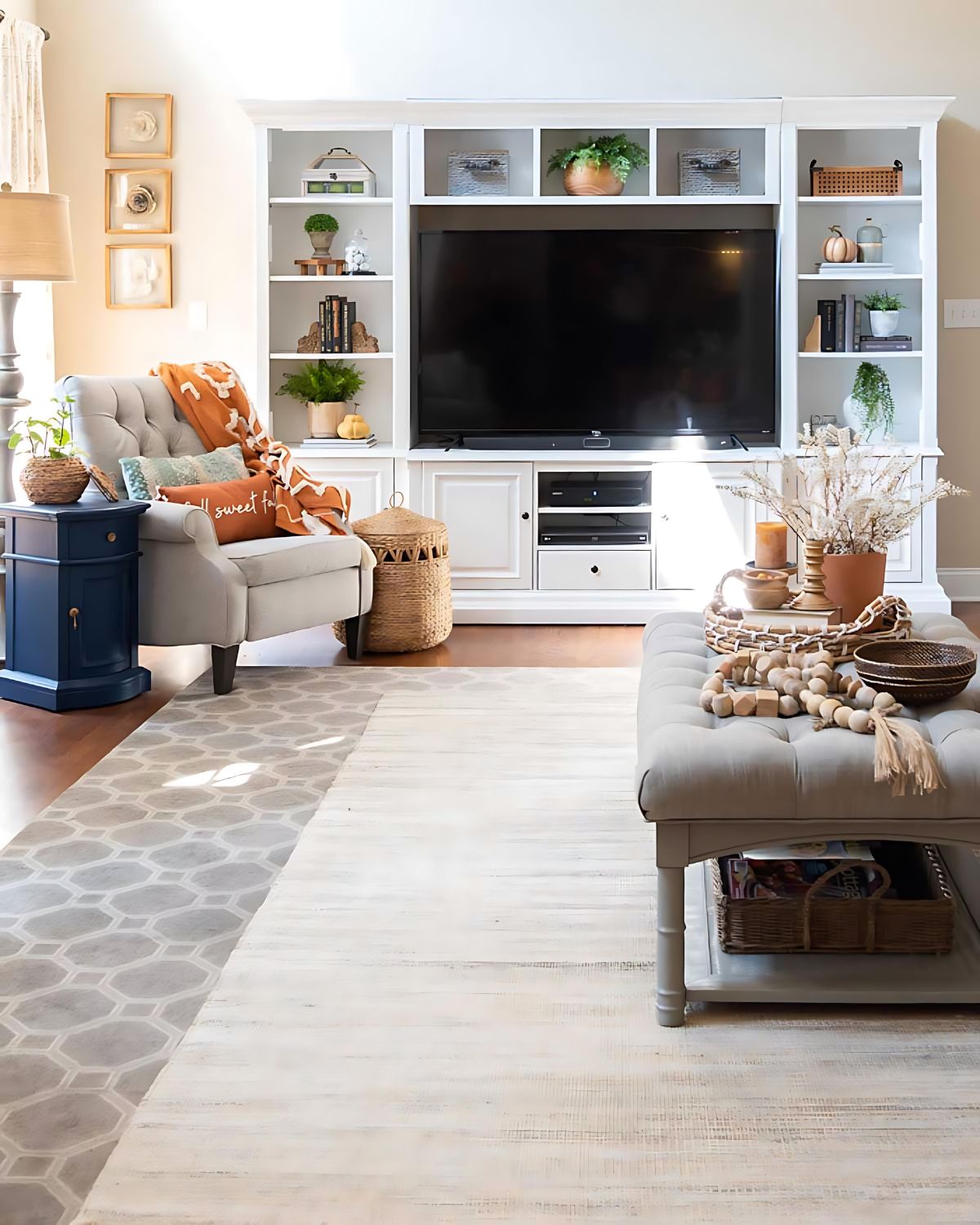 layered area rugs in a cozy neutral lining room