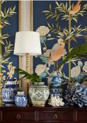 collection of chinoiserie accessories on a sofa table to create a cozy feel