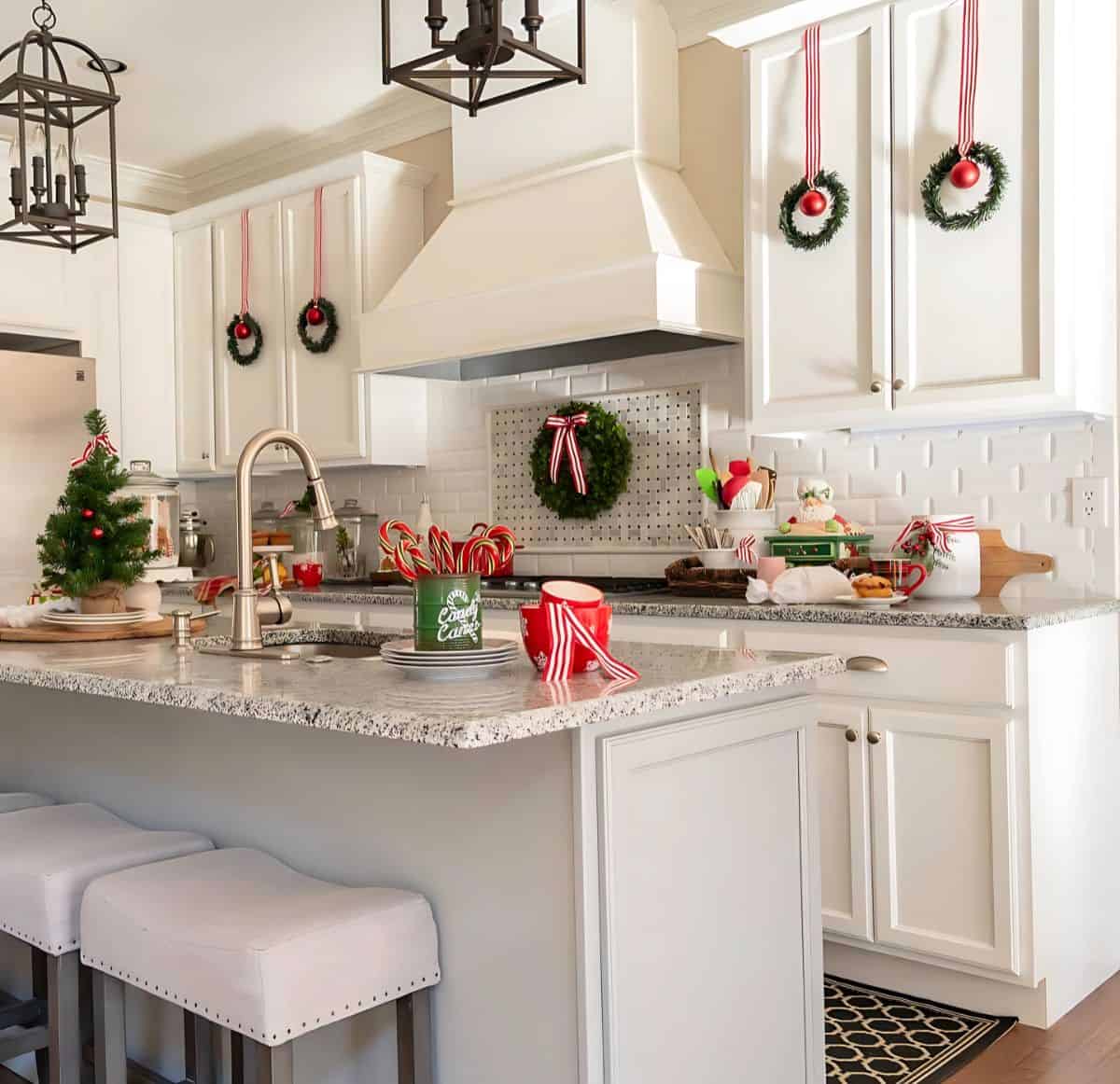 kitchen with white cabinets decorated for Christmas