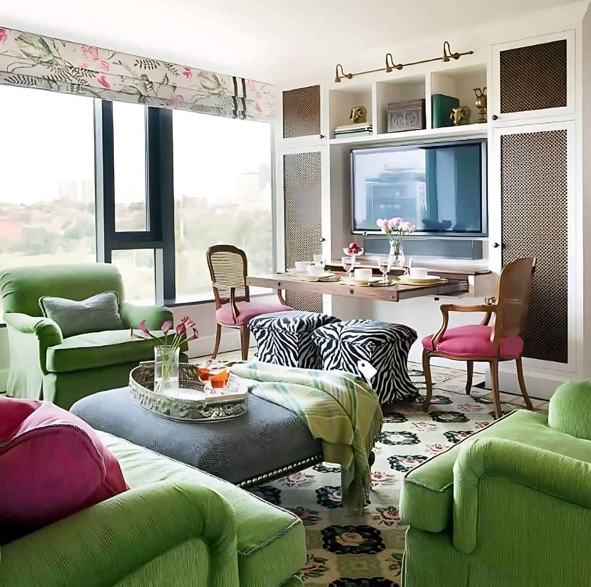 family room decorated with green sofa and chairs and a separate zone for playing games