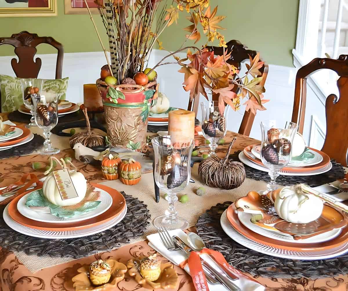 Woodland theme Thanksgiving tablescape in traditional fall colors