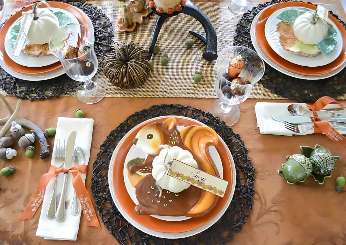 Woodland theme Thanksgiving tablescape in traditional fall colors