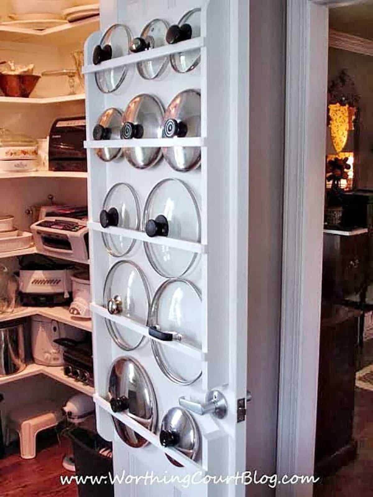 pot lids stored on a pantry closet door