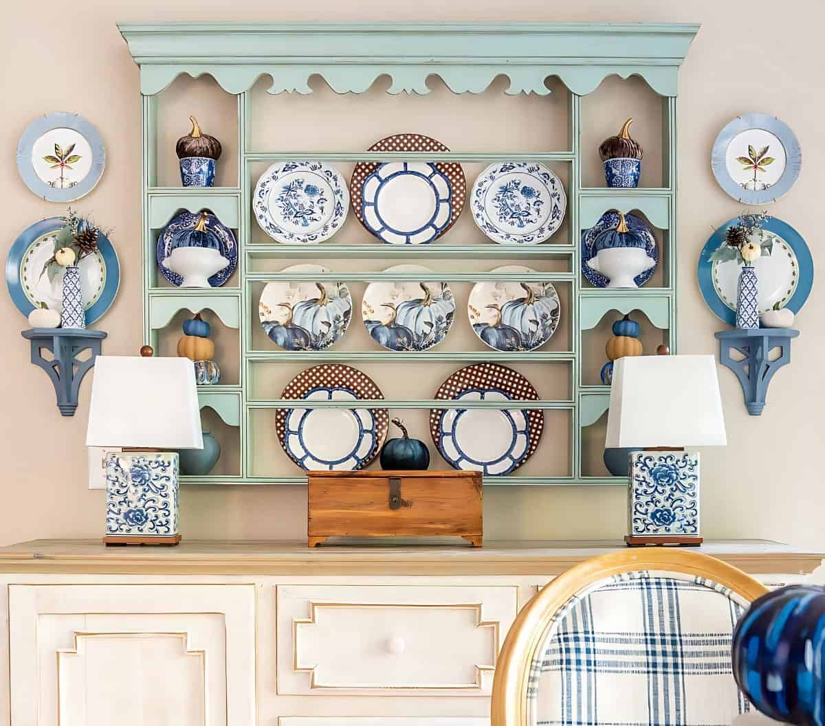 blue, white and brown dishes displayed on a plate rack for fall