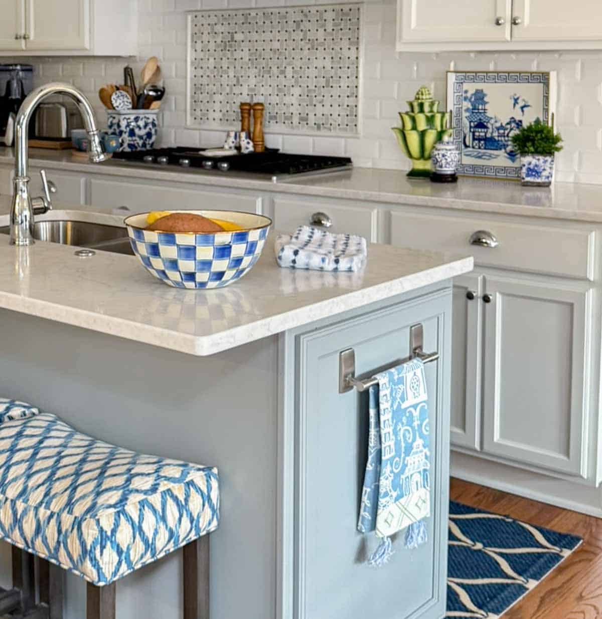 blue, white, and green accessories in an all white kitchen