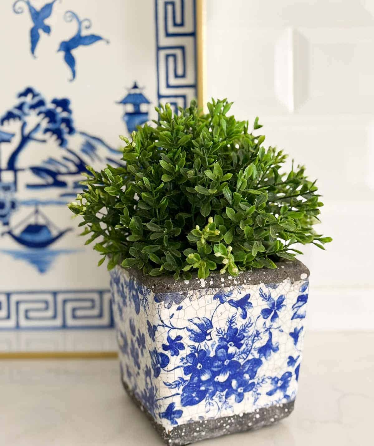 blue, white, and green accessories in an all white kitchen